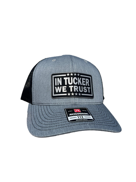 In Tucker We Trust Hat with Laser Engraved Premium Leatherette Patch on a Richardson 112 Trucker Hat.