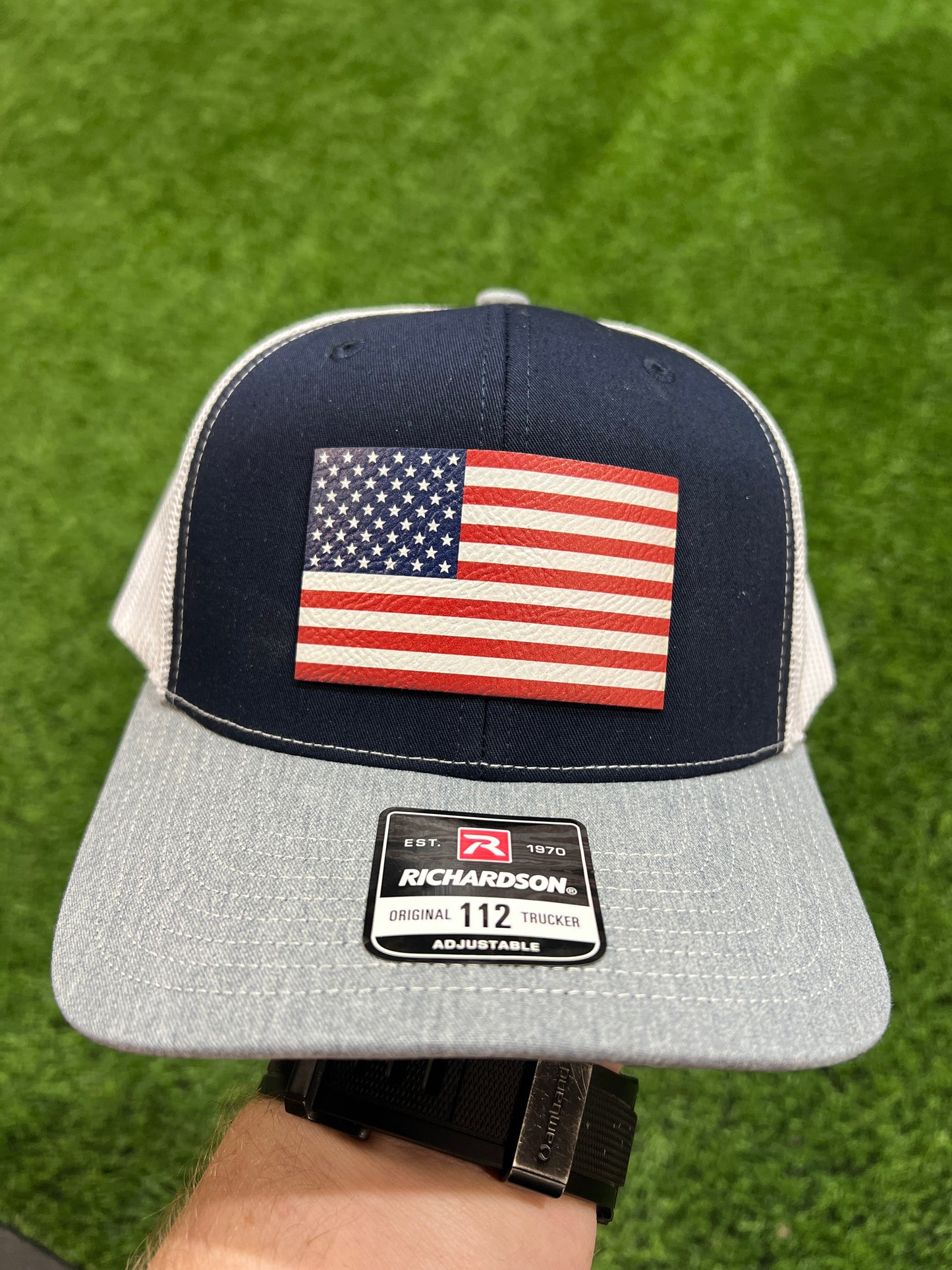 American Flag Hat UV Printed Premium Leatherette Patch on a Richardson 112 Trucker Hat.