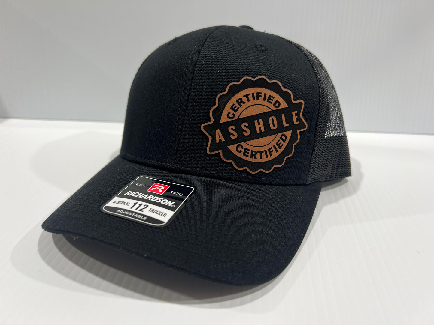 Certified A-Hole Hat with Engraved Leatherette Patch on Richardson 112 Trucker Hat