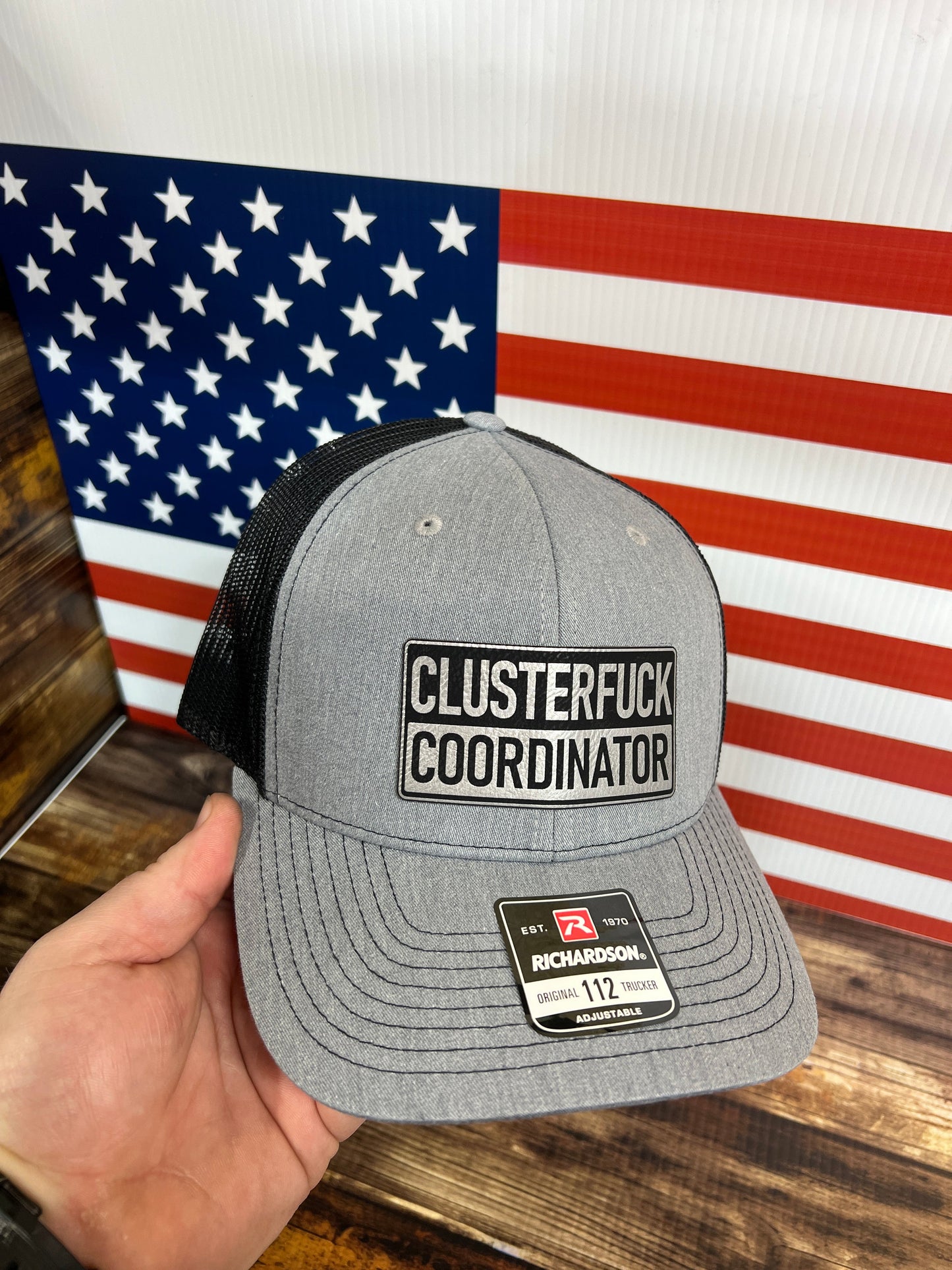 Clusterfu*k Coordinator Trucker Hat with Premium Leatherette Patch on a Richardson 112 Hat