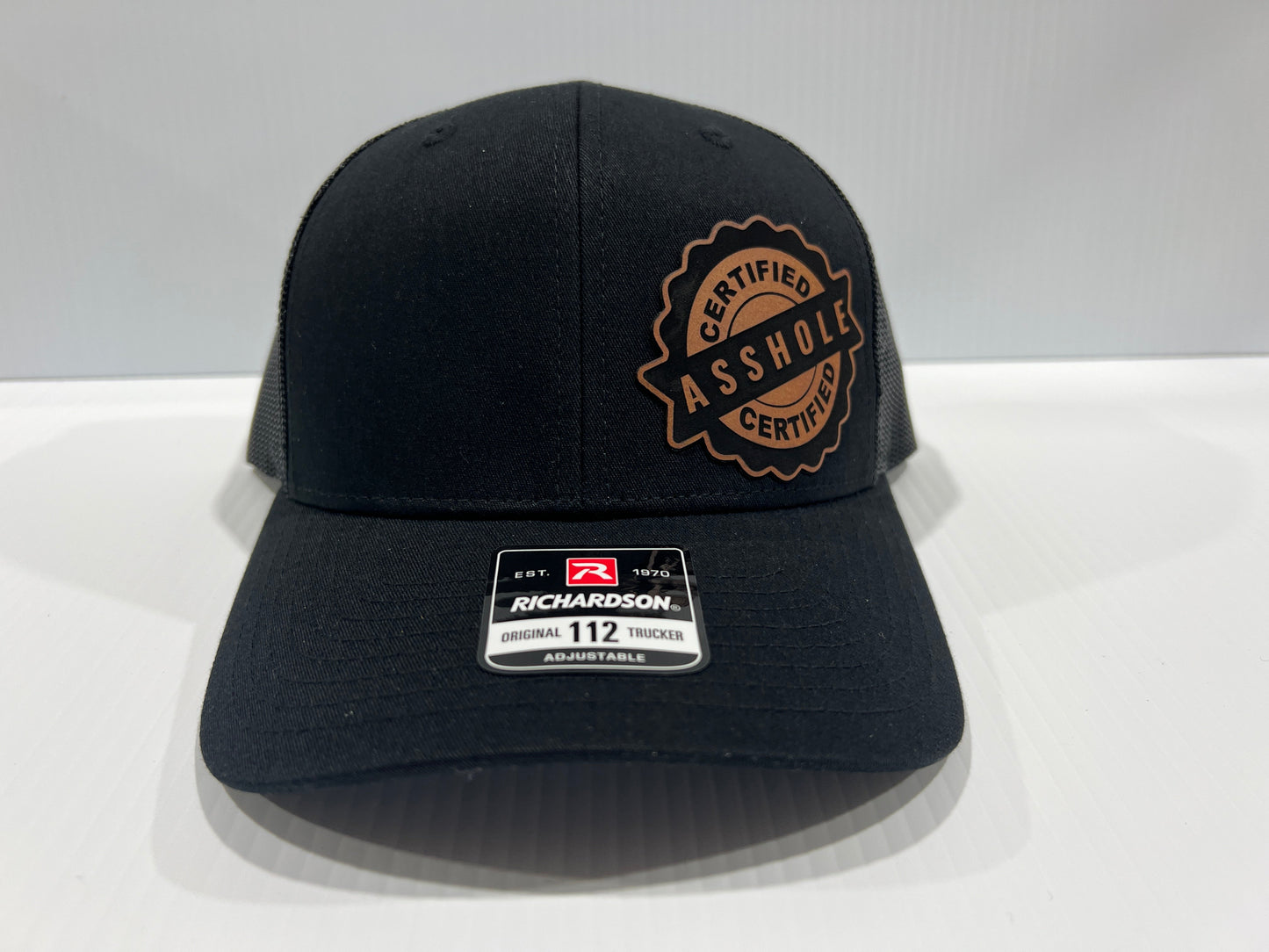 Certified A-Hole Hat with Engraved Leatherette Patch on Richardson 112 Trucker Hat