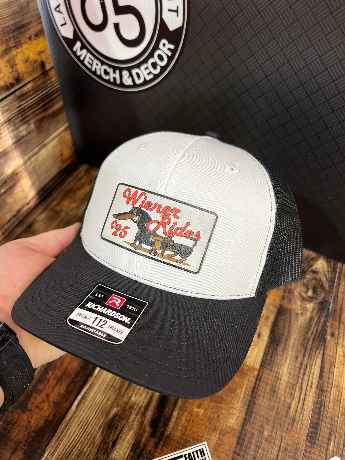 Wiener Rides Patch Hat with a UV Printed Premium Leatherette Patch on a Richardson 112 Trucker Hat