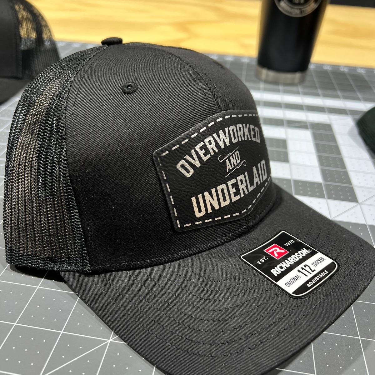 Overworked and Underlaid Patch Hat Richardson 112 Trucker hat with Snap Back